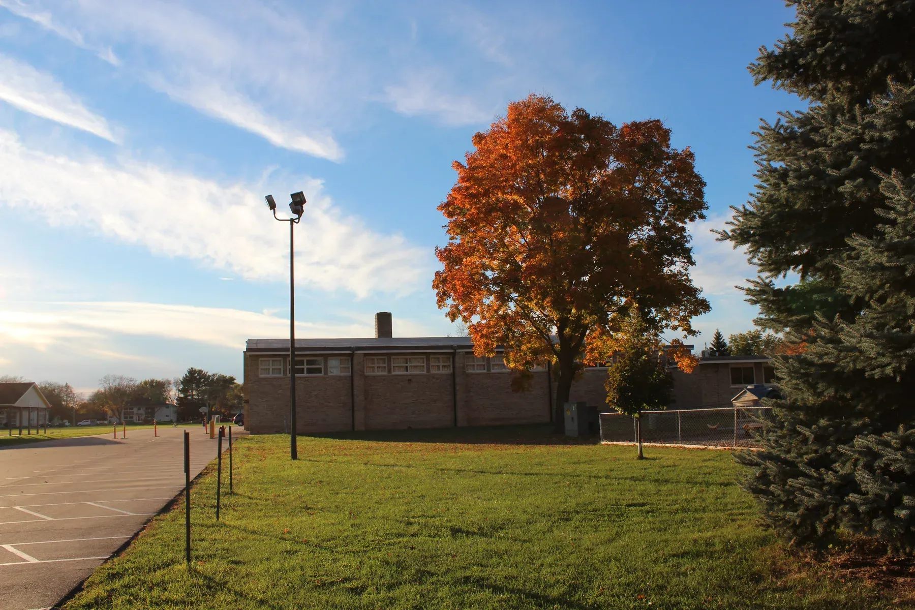 St. Aloysius campus beside an autumn tree, photographed in 2016